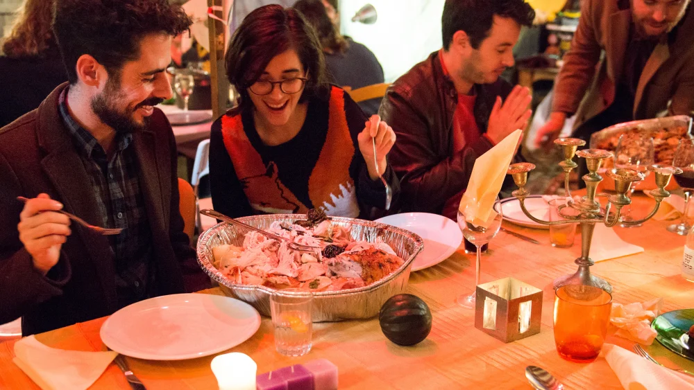 Israelis and Americans enjoy a Thanksgiving dinner together in Tel Aviv on Nov. 29, 2014. Photo by Danielle Shitrit/Flash90.