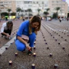 Israelis prepare for a display of 25,000 memory candles in honor of the 25th Memorial Day for the assassination of Prime Minister Yitzhak Rabin at Rabin Square in Tel Aviv on Oct. 29, 2020. Photo by Tomer Neuberg/Flash90.