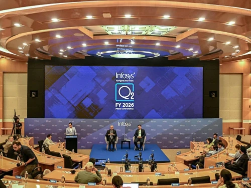 The Infosys group's CEO and Managing Director Salil Parekh (center left) and Executive Vice President and CFO Jayesh Sanghrajka (center right) hold a press conference to announce second quarter results in Bengaluru, India, on Oct. 16, 2025. Photo by Idrees Mohammed/AFP via Getty Images.