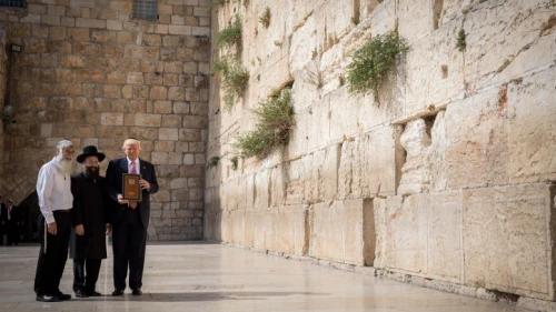 U.S. President Donald Trump at the Western Wall, Judaism's holiest prayer site, in the Old City of Jerusalem on May 22, 2017. To his left is the rabbi of the wall, Chabad Rabbi Shmuel Rabinovitch. Photo by Nati Shohat/Flash90.