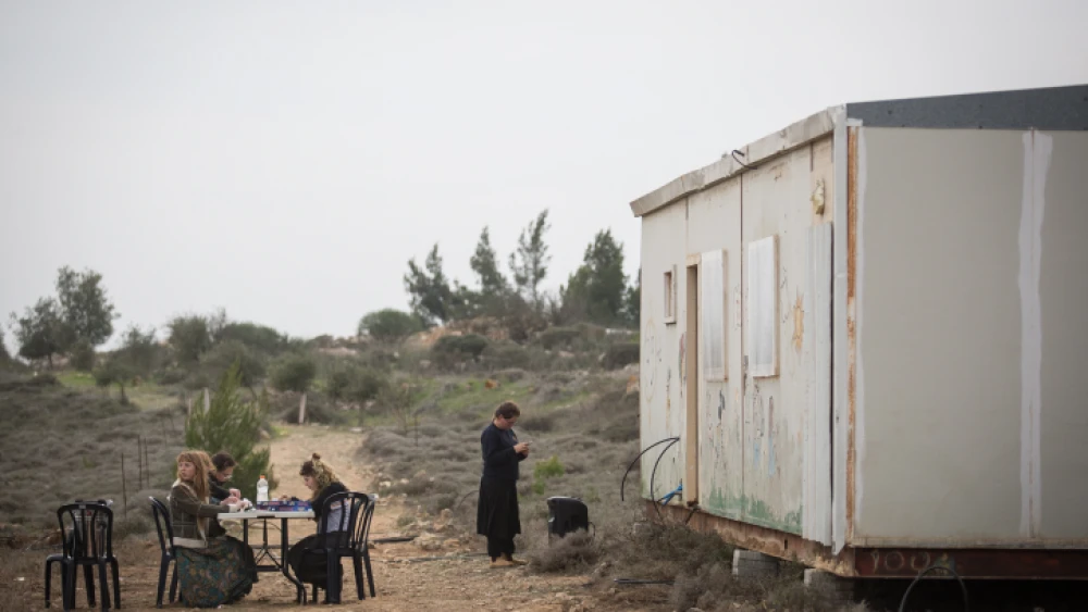 Young Israelis seen at the former outpost of Amona in Samaria, which was evacuated nearly two years ago. Dec. 16, 2018. Photo by Hadas Parush/Flash90.