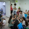 People take cover as siren warns of incoming missiles fired from Iran at a public bomb shelter in Jerusalem, June 20, 2025. Photo by Noam Revkin Fenton/Flash90.