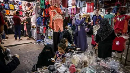 Palestinians shop at a market ahead of the Eid al-Adha festival, in Rafah, in the southern Gaza Strip, on June 27, 2023. Photo by Abed Rahim Khatib/Flash90.