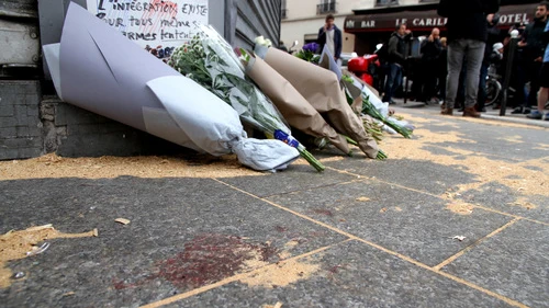 The Le Petit Cambodge restaurant—site of one of six coordinated Islamist terror attacks in Paris on Friday—with a makeshift memorial of flowers and blood staining the ground on the day after the attacks. Credit: Maya-Anaïs Yataghène via Wikimedia Commons.