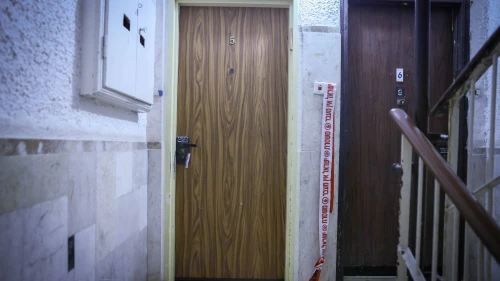 Police tape outside an apartment in central Jerusalem where an elderly woman was found wounded, on Dec. 19, 2024. Photo by Chaim Goldberg/Flash90.