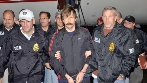 Viktor Bout, a Russian arms dealer known as the “Merchant of Death,” escorted by U.S. federal agents, Nov. 16, 2010. Credit: DEA.