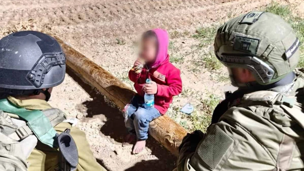 A child who said he was sent by Hamas is greeted by Israeli soldiers at an IDF post in the Gaza Strip on March 11, 2025. Credit: IDF.