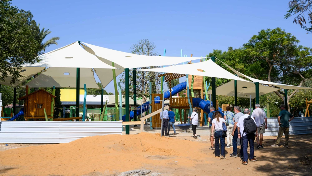 The Kass family and guests tour a playground under construction at Kibbutz Re'im, Nov. 5, 2025. Photo by Ron Rahamim.