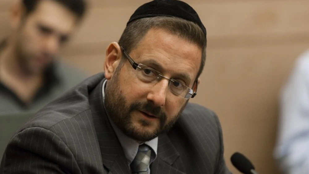 Member of Knesset Rabbi Dov Lipman (Yesh Atid) is pictured in an Immigration, Absorption and Diaspora Affairs Committee meeting in the Knesset on Nov. 19, 2013. Lipman and several other Knesset members recently introduced legislation that would make any illegitimate use of the word “Nazi” or Nazi symbols punishable by law. Credit: Flash90.