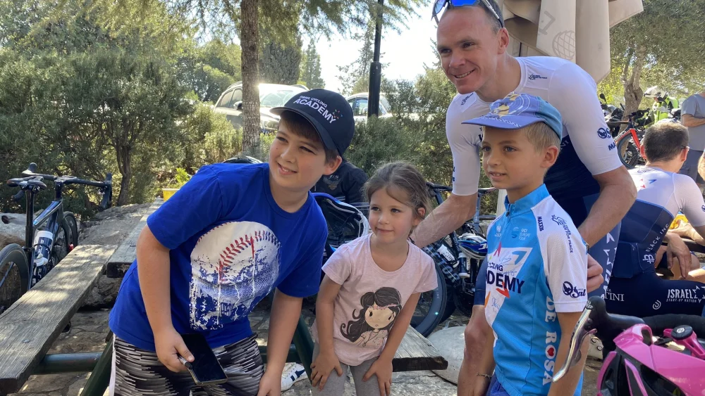 Four-time Tour de France winner Chris Froom greets some of his younger fans during a stop outside of Jerusalem by members of Team Israel Start-Up Nation. Source: Twitter.