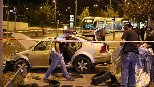 Click photo to download. Caption: Police and resuce personnel at the scene where a car crashed into Jerusalem's Ammunition Hill light rail station in a terror attack on October 22, 2014. Credit: Flash90.
