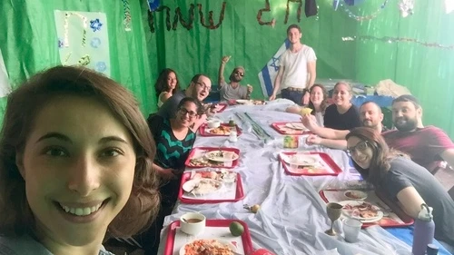 Click photo to download. Caption: Eliana Rudee in the sukkah with her ulpan classmates. Credit: Courtesy Eliana Rudee.
