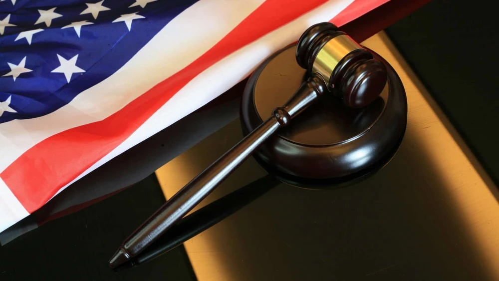 Gavel next to American flag. Credit: Sergei Tokmakov/Pixabay.