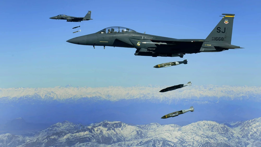U.S. Air Force F-15Es drop 2,000-pound Joint Direct Attack Munitions on a cave in eastern Afghanistan, Nov. 26, 2009. Credit: Staff Sgt. Michael B. Keller/U.S. Air Force Photo via Wikimedia Commons.