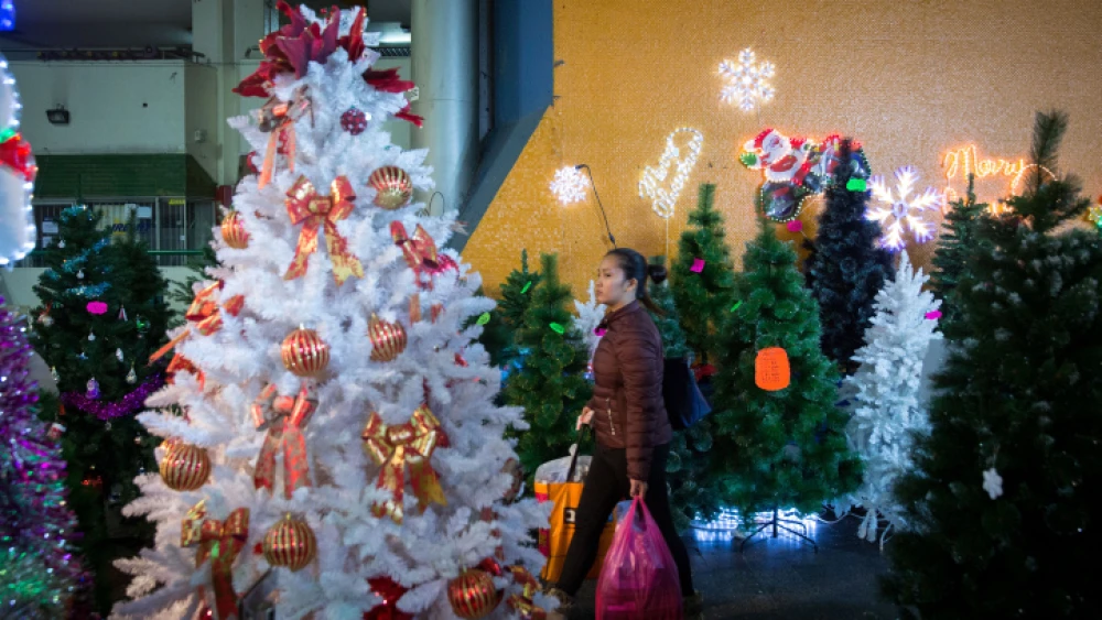 Shoppers at a Christmas market at the Central Bus Station in South Tel Avivon Dec. 9, 2018. Photo by Miriam Alster/Flash90.