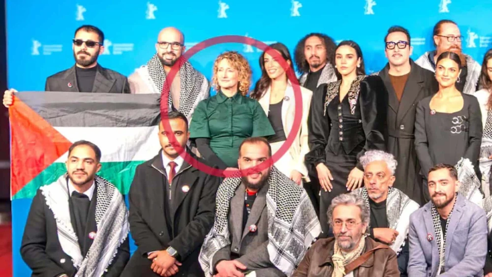 Tricia Tuttle, in red circle, poses with the team of the film "Chronicles from the Siege" in February 2026 in Berlin, Germany. Photo courtesy of Berlinale via Bild.
