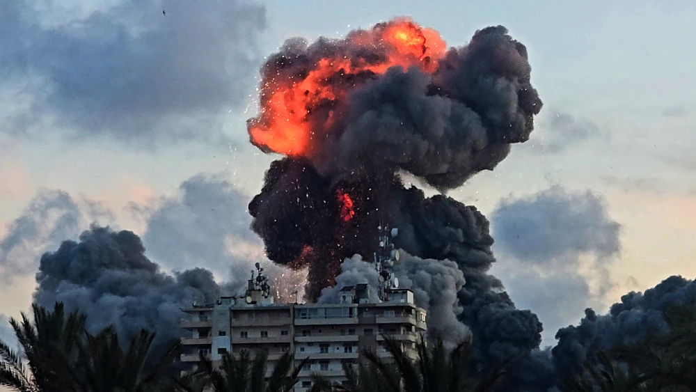 A fireball and smoke erupt from a building following an Israeli strike in Tyre, Southern Lebanon, on May 28, 2026. Photo by Kawant Haju / AFP via Getty Images.