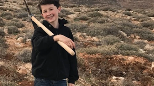 Lavi Gimpel at the site of the farm his family is establishing in the Judean Hills. Credit: Courtesy of Gimpel family.