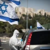Magen David Adom staff perform drive-through COVID-19 tests on Arab residents of the eastern Jerusalem neighborhood of Sheikh Jarrah, on Aug.17, 2020. Photo by Yonatan Sindel/Flash90.