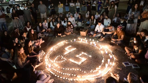 Israelis light candles in Tel Aviv's Rabin Square for the 45 victims killed in a crushing crowd at Mount Meron during Lag B'Omer celebrations, May 2, 2021. Photo by Tomer Neuberg/Flash90.