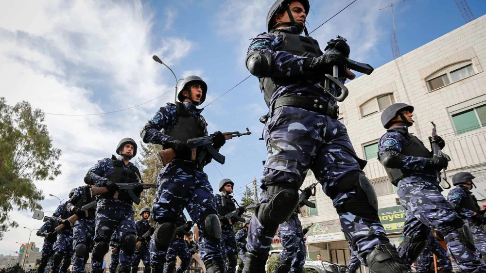 Palestinian Authority security personnel parade in the Judea city of Hebron, Nov. 14, 2017. Photo by Wisam Hashlamoun/Flash90.