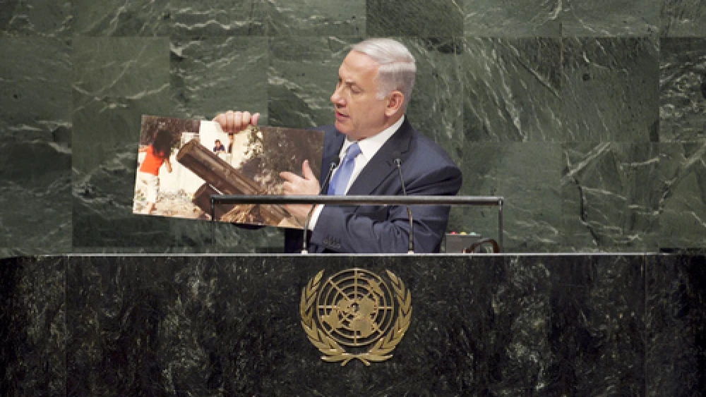 Israeli Prime Minister Benjamin Netanyahu, addressing the U.N. General Assembly in New York City, points to a picture of a Palestinian rocket-launcher stationed in a civilian area of Hamas-controlled Gaza. Credit: U.N. Photo/Amanda Voisard.