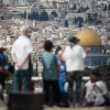 Tourists take in the view of the Dome of the Rock and Temple Mount from the Mount of Olives platform overlooking the Old City of Jerusalem, on Oct. 11, 2018. Photo by Hadas Parush/Flash90.