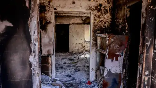 Israeli soldiers around the destruction caused by Hamas terrorists in Kfar Aza, near the Gaza border in southern Israel, Oct. 10, 2023. Photo by Chaim Goldberg/Flash90.
