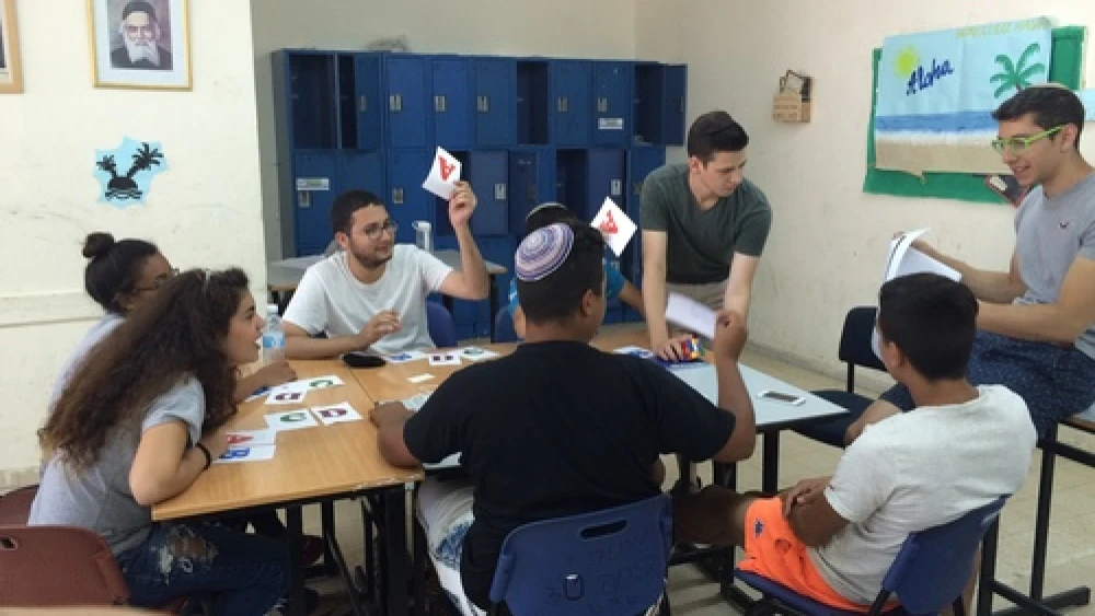 Zach Katz (second from right, standing) of Bergenfield, N.J., and Elan Rotenberg (far right) of Baltimore, Md., run an English class for Counterpoint Israel campers in Kiryat Gat. Credit: Courtesy.
