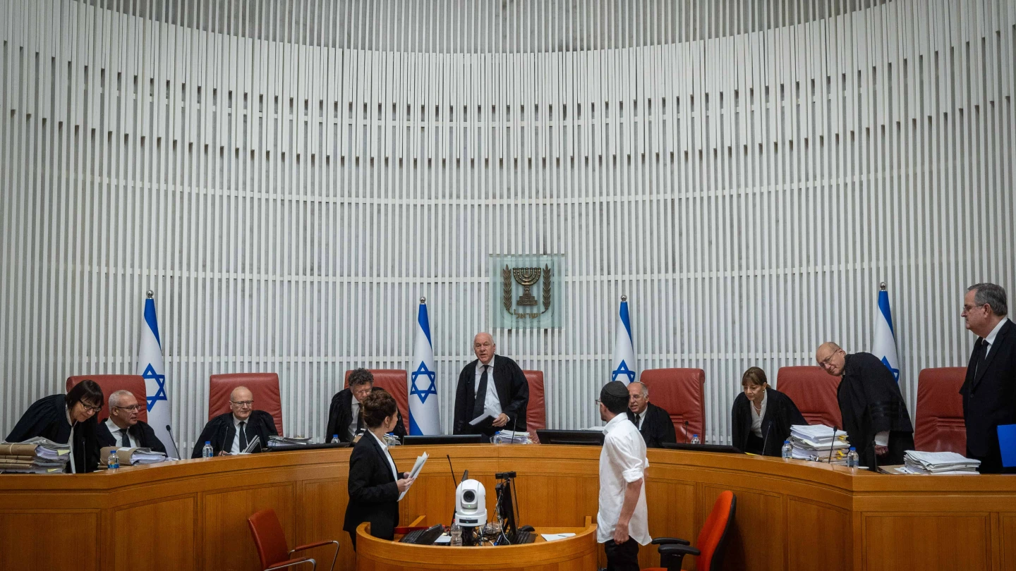 Acting President of the Israeli Supreme Court Uzi Vogelman and fellow justices arrive at a hearing in Jerusalem on June 18, 2023. Credit: Yonatan Sindel/Flash90.