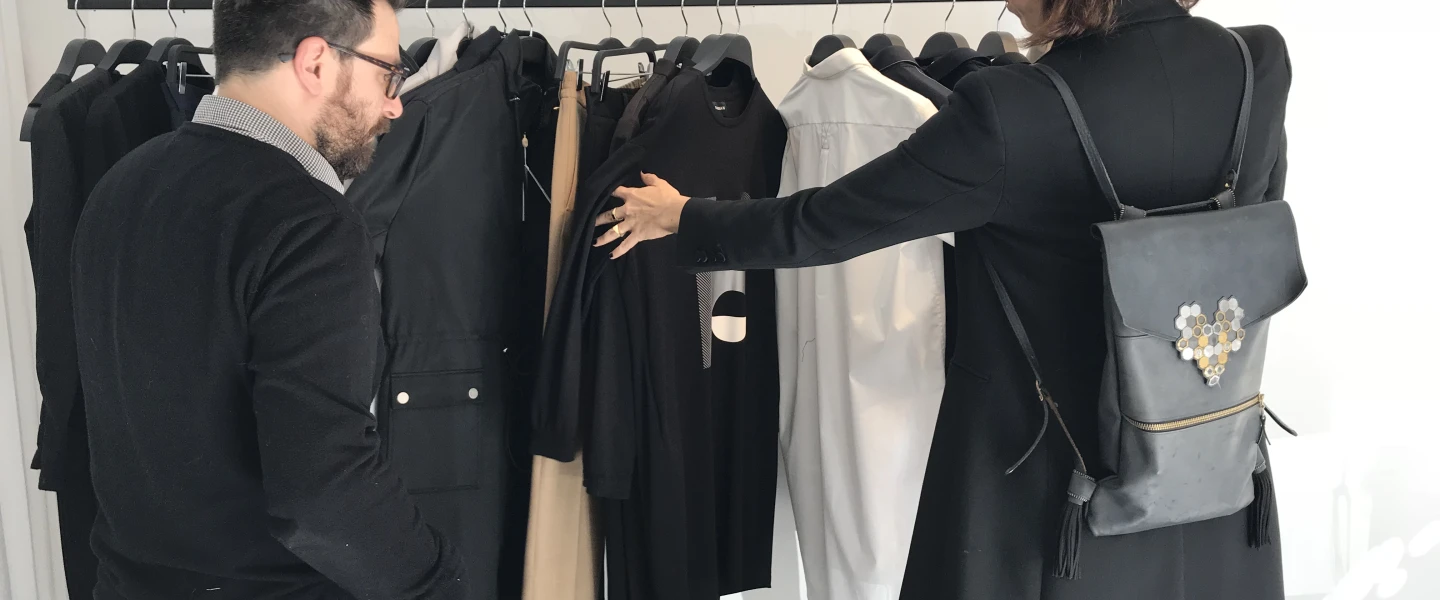 Nir Goeta and Galit Reismann look through Nir’s designs. Credit: Eliana Rudee.