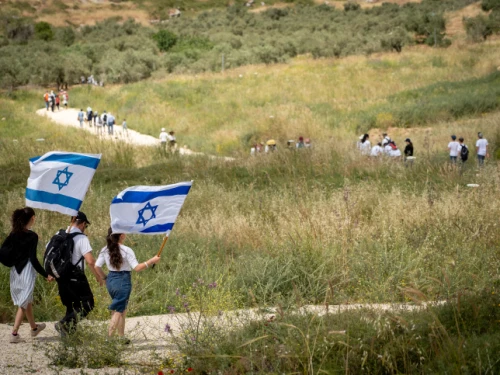 Israelis participate in a march to celebrate Israel's 71st Independence Day near Havat Gilad in Judea and Samaria on May 9, 2019. Photo by Hillel Maeir/Flash90.
