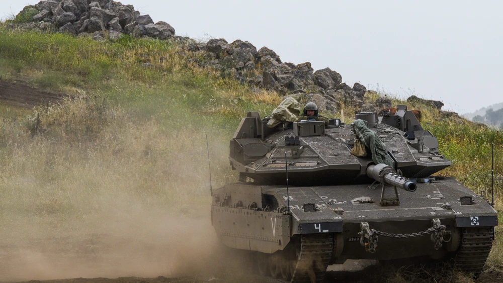 Israeli soldiers seen near the Israeli-Syrian border in the Golan Heights on May 7, 2018. Credit: Basel Awidat/Flash90.