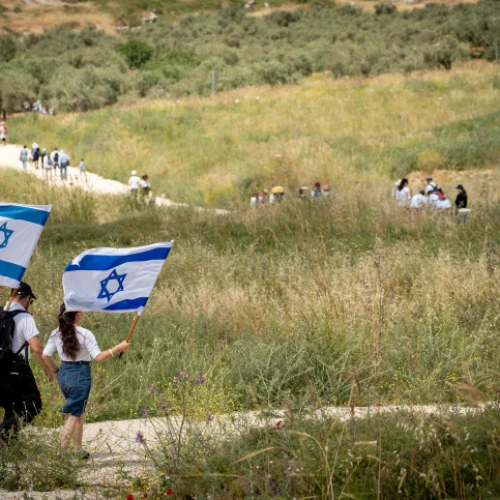 Israelis participate in a march to celebrate Israel's 71st Independence Day near Havat Gilad in Judea and Samaria on May 9, 2019. Photo by Hillel Maeir/Flash90.