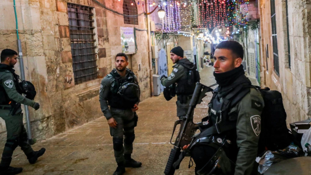 Security personnel at the scene in Jerusalem's Old City where a man was shot dead after trying to steal a police officer’s weapon, April 1, 2023. Photo by Jamal Awad/Flash90.
