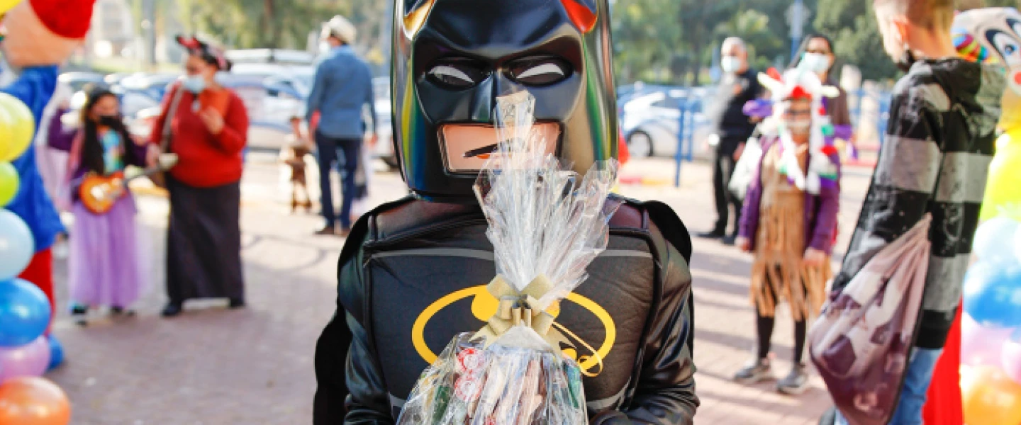 Kids dressed up in costumes arrive at their school ahead of the Jewish holiday of Purim in Sderot, southern Israel on Feb. 24, 2021. Photo by Flash90.