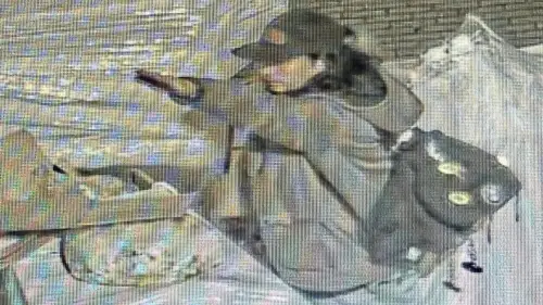 A man performs what appears to be the Nazi salute before setting on fire boxes in front of a synagogue in Giessen, Germany. Photo courtesy of EJA.