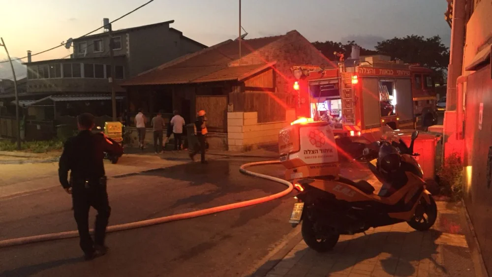 Israeli police and emergency service treat a man injured by rocket fire from Gaza in Sderot. Source: United Hatzalah via Twitter.