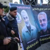 Palestinians in Gaza City walk next to posters of Qassem Soleimani, who was killed in a U.S. drone strike in Iraq a day earlier. Jan. 4, 2020. Photo by Hassan Jedi/Flash90.