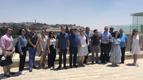 Ambassadors from several nations pose at the Aish HaTorah Center in the Old City of Jerusalem overlooking the Western Wall. Photo by Josh Hasten.