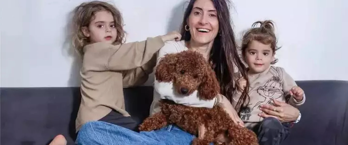The Yung family with their dog, Monty. Photo by Yehoshua Yosef.