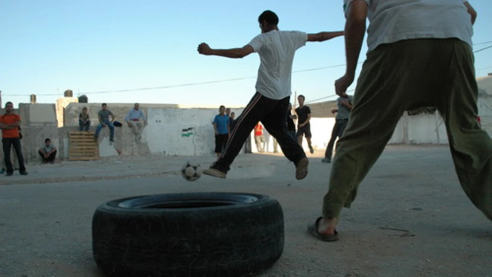 Palestinians play soccer in the West Bank. Credit: Justin McIntosh via Wikimedia Commons.