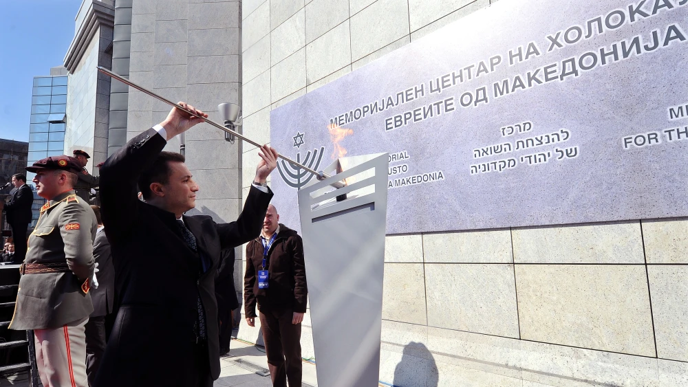 Former North Macedonian Prime Minister Nikola Gruevski lights the eternal flame in Skopje