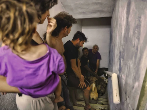 Israelis take cover as air-raid sirens are activated in Tel Aviv, Oct. 23, 2024. Photo by Yehoshua Yosef/Flash90.