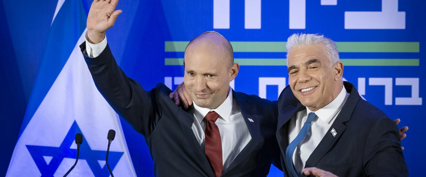 Yair Lapid and Naftali Bennett speak during a press conference announcing a joint list named “Together” ahead of upcoming elections, to be led by Bennett, in Herzliya, April 26, 2026. Photo by Chaim Goldberg/Flash90.