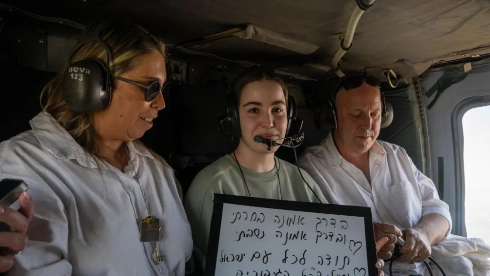 Former Israeli hostage Agam Berger with her parents, Meirav and Shlomi, aboard an Israeli Air Force helicopter en route to a hospital following her release after 482 days in Hamas captivity, Jan. 30, 2025. Credit: IDF Spokesperson’s Unit.