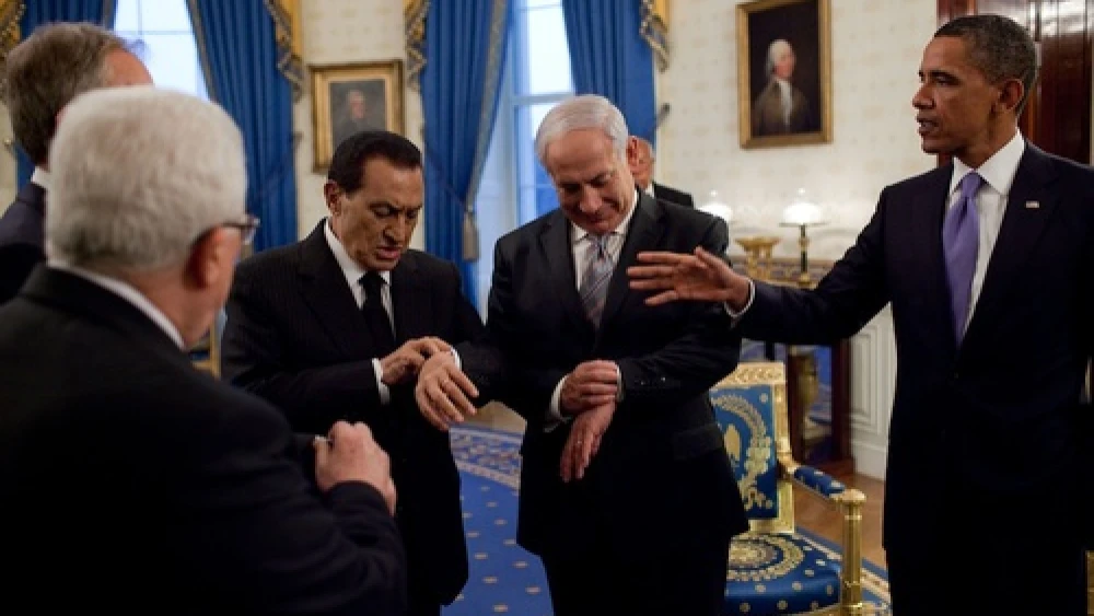 Click photo to download. Caption: President Barack Obama (far right) with Israeli Prime Minister Benjamin Netanyahu and then Egyptian President Hosni Mubarak—both checking their watches—in September 2010 at the White House. Credit: White House.
