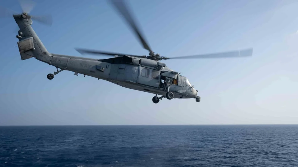 A U.S. military helicopter takes off from guided-missile destroyer USS Pinckney to patrol regional waters as part of the naval blockade of Iran, April 19, 2026. Credit: United States Central Command.