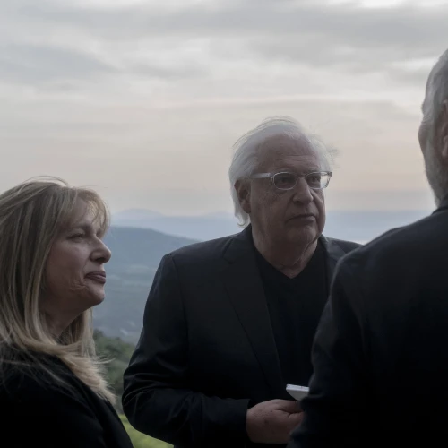 David and Tammy Friedman, facing camera, speak to an attendant of a ceremony held at Ein Kshatot, Israel on March 25, 2025. Photo by Canaan Lidor.