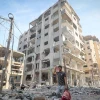 A Palestinian walks past the rubble of houses destroyed by Israeli airstrikes in the Jabalia area in the northern Gaza Strip, Oct. 11, 2023. Photo: Atia Mohammed/Flash90